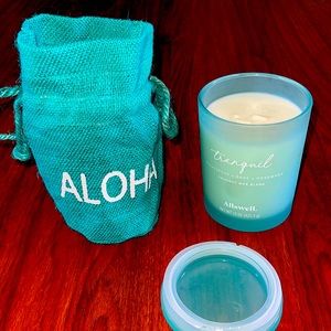 All swell tranquility double wick coconut wax blend candle in a aloha burlap bag